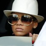 Rihanna straw hat red fingernails in SOHO Rihanna straw hat red fingernails in SOHO